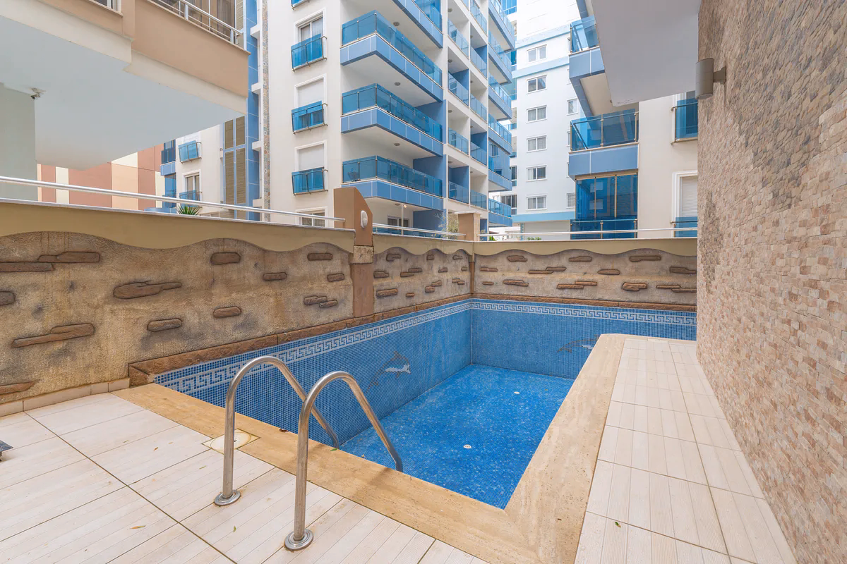 Buy Apartment Mahmutlar Alanya — Spacious 85 m² 1+1 in Hes Cebeci (19) Outdoor swimming pool at Hes Cebeci complex Mahmutlar Alanya