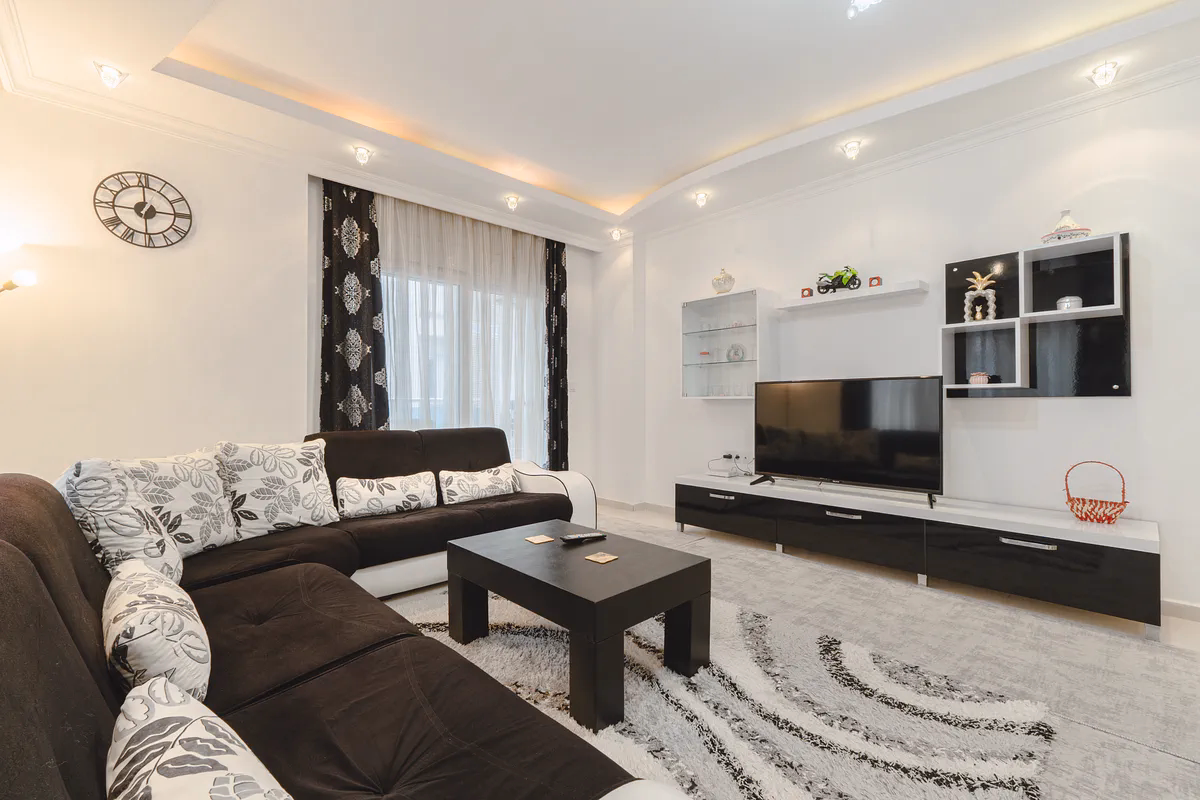 Buy Apartment Mahmutlar Alanya — Spacious 85 m² 1+1 in Hes Cebeci (4) Spacious furnished living room in Hes Cebeci Mahmutlar Alanya