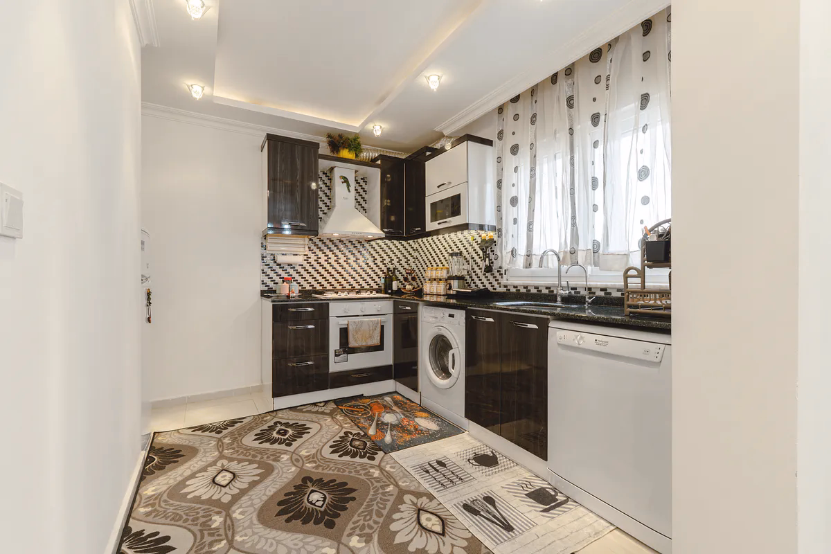Buy Apartment Mahmutlar Alanya — Spacious 85 m² 1+1 in Hes Cebeci (5) American open kitchen in Hes Cebeci furnished apartment Mahmutlar