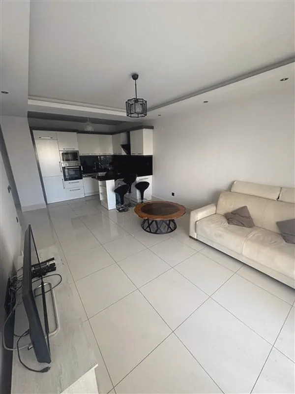 Buy Apartment in Alanya Turkey – Furnished 1+1 Apartment in Nordic Life Residence, Tosmur (18) Bright lounge area in Nordic Life Residence Tosmur