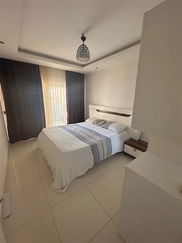 Buy Apartment in Alanya Turkey – Furnished 1+1 Apartment in Nordic Life Residence, Tosmur (19) Spacious bedroom in Tosmur Alanya apartment