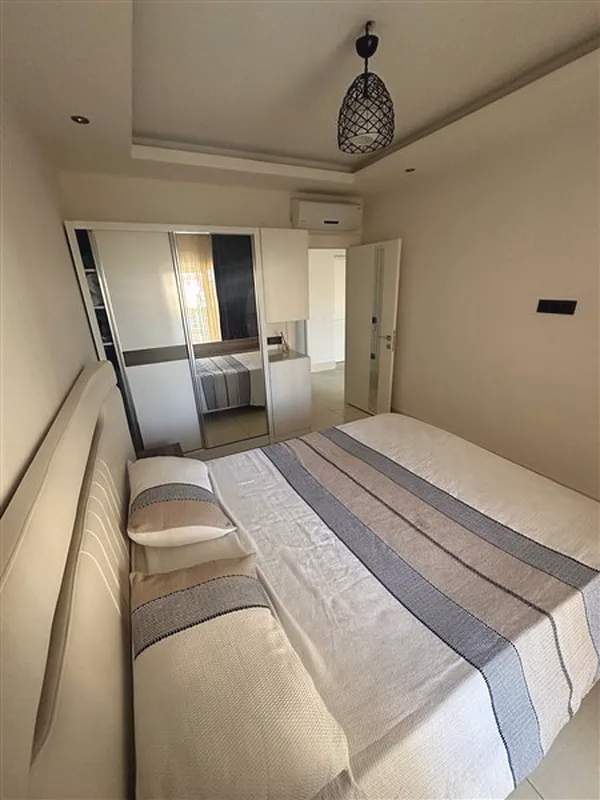 Buy Apartment in Alanya Turkey – Furnished 1+1 Apartment in Nordic Life Residence, Tosmur (21) Spacious bedroom in Tosmur Alanya apartment