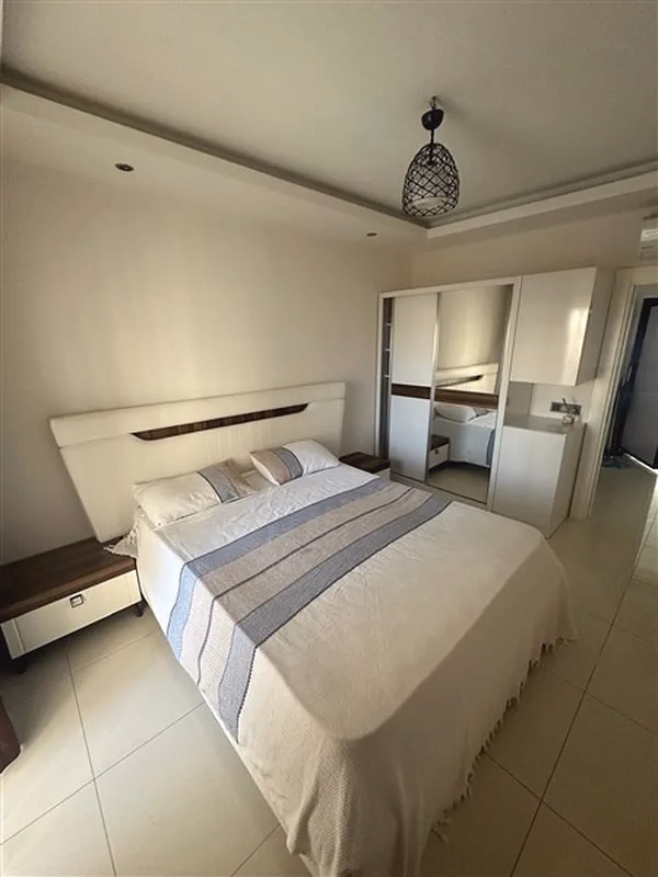 Buy Apartment in Alanya Turkey – Furnished 1+1 Apartment in Nordic Life Residence, Tosmur (23) Spacious bedroom in Tosmur Alanya apartment
