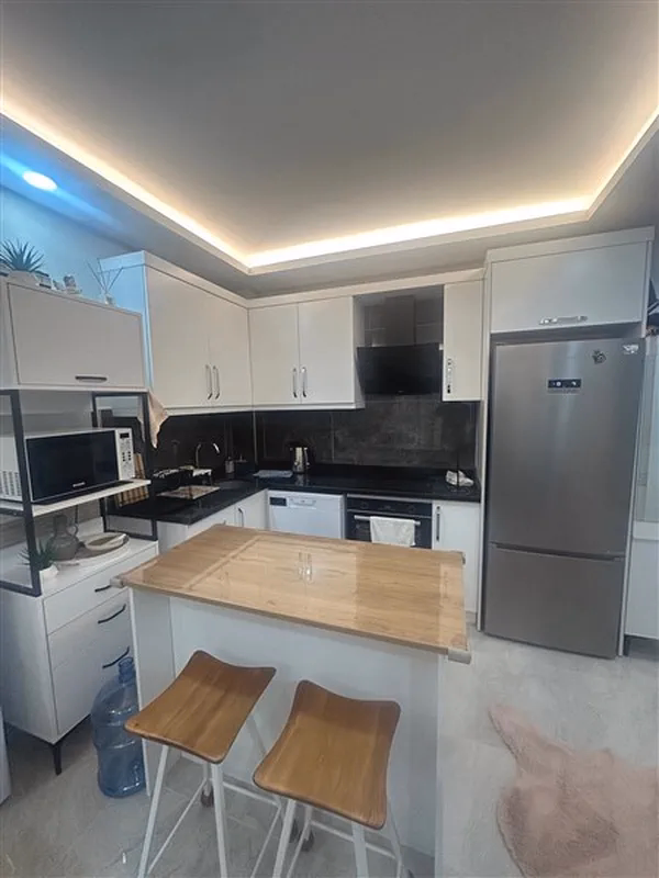 Furnished 1+1 Apartment in White Residence Oba (3) Open-plan kitchen in White Residence Alanya property